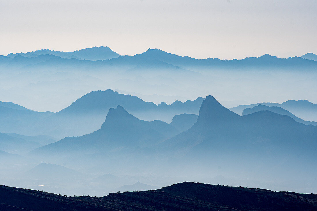 Foggy mountain range, Al Hajar, Jebel Shams, Oman