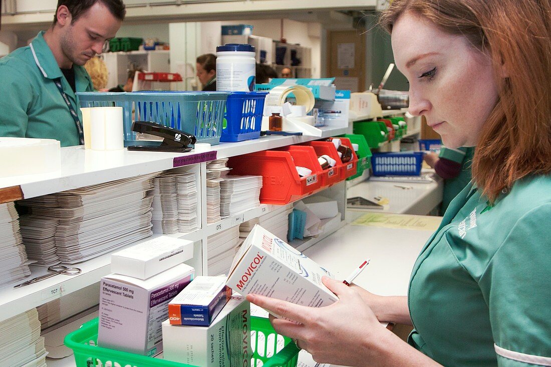 Pharmacy technician checking a prescription