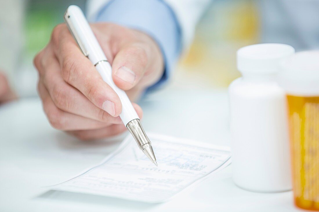 Pharmacist writing prescription