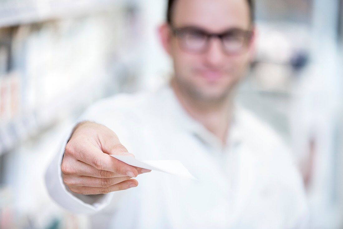 Pharmacist showing prescription