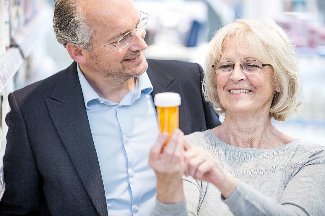 Senior woman and man in pharmacy