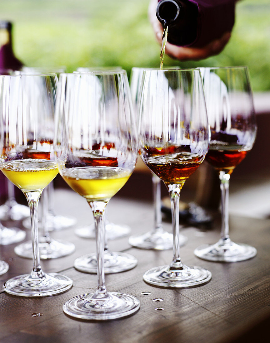 Wine being poured into glasses