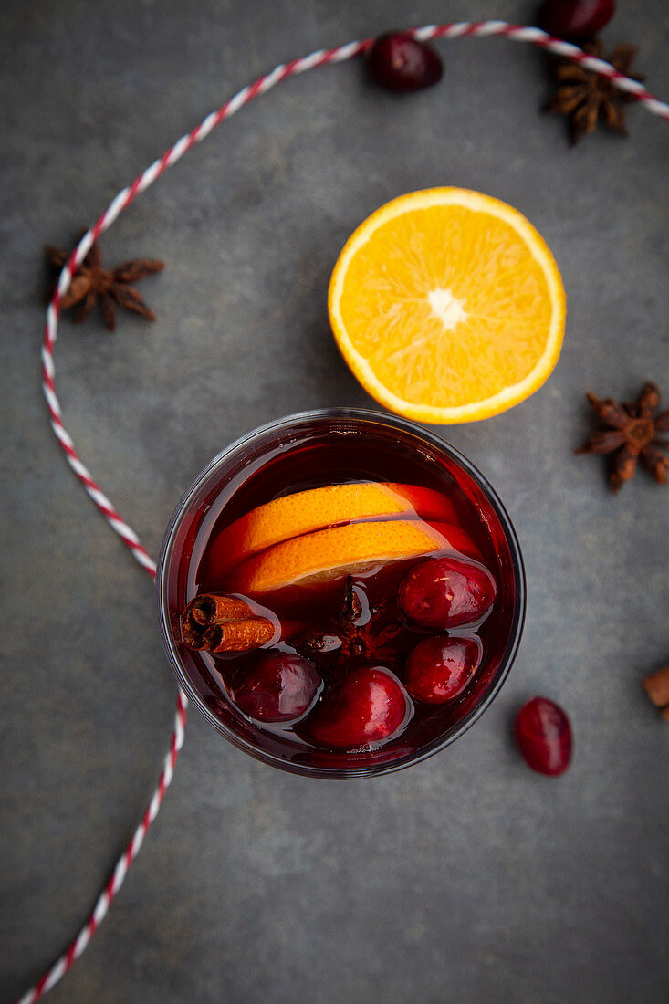 Mulled wine with cranberries, cinnamon, orange slices and star anise