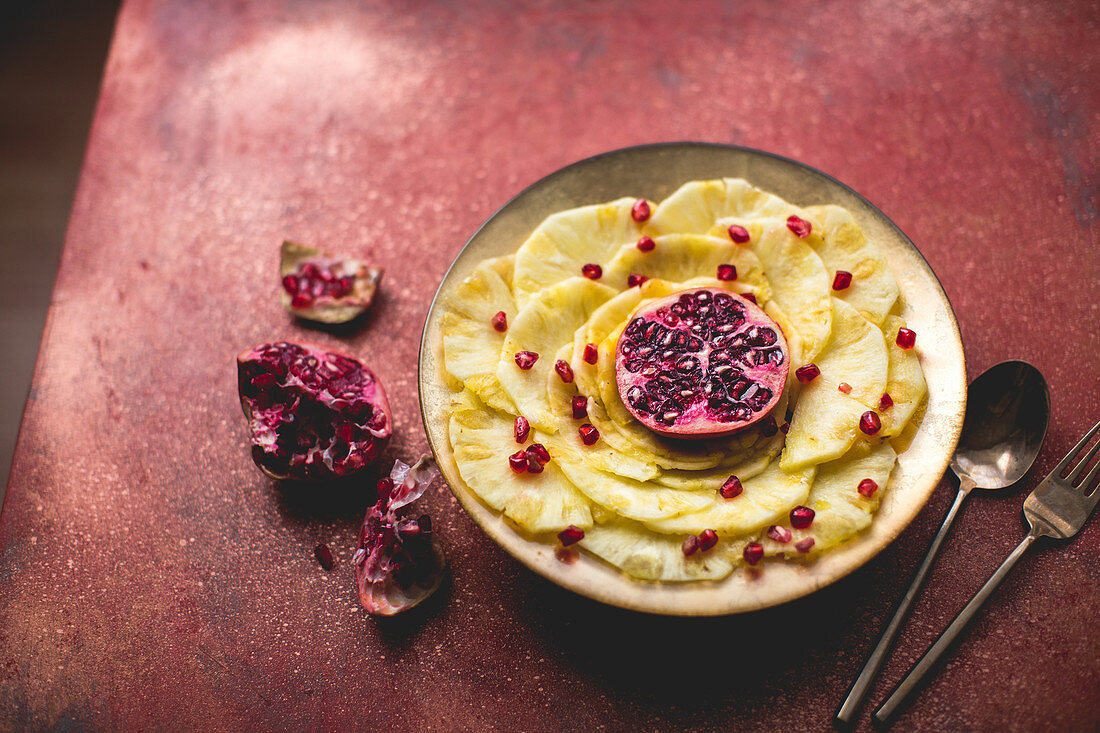 Pineapple carpaccio with lime and pomegranate