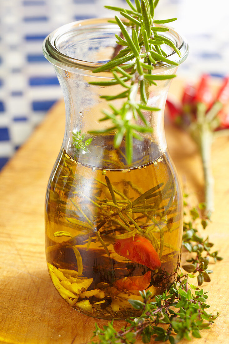 Homemade Mediterranean olive oil with herbs and chilli