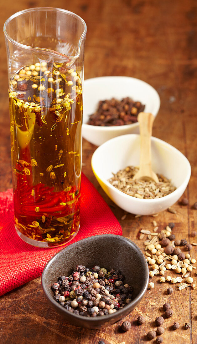 Homemade savory spice oil in a glass carafe