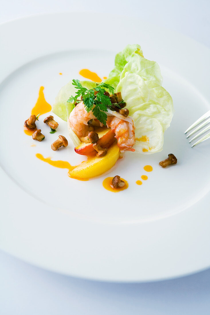 Crayfish with salad, chanterelles and glazed peaches
