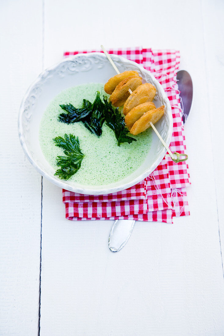 Green celery soup with baked celeriac biscuits