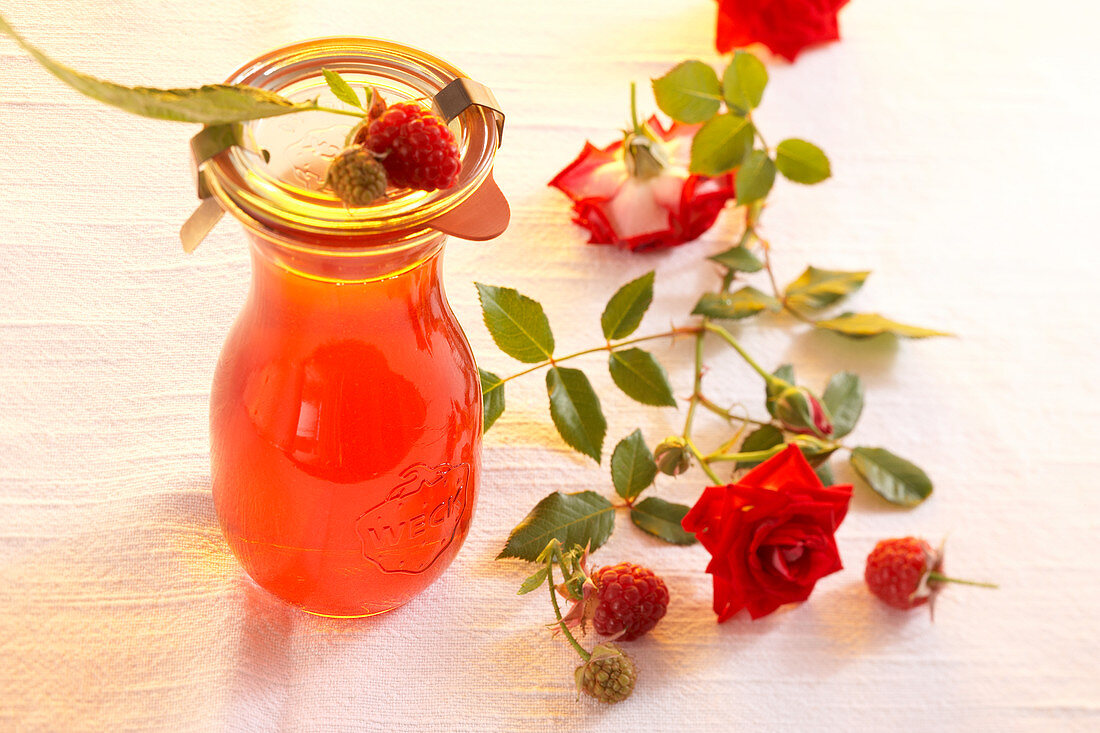 Homemade rose vinegar with raspberries