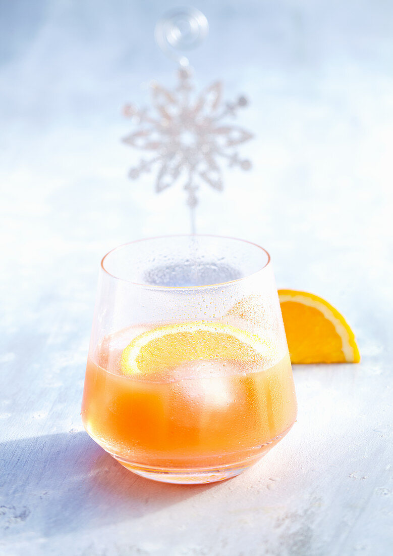 Campari orange with fruit slice and ice cubes (Christmas)