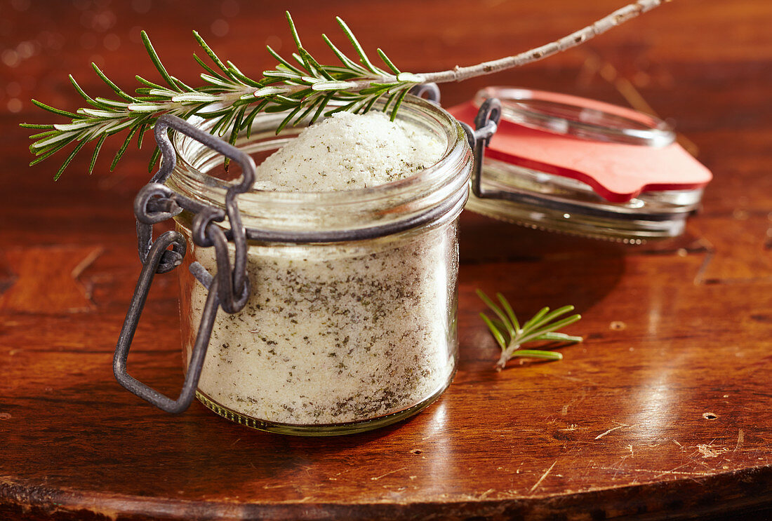 Homemade rosemary sugar in a glass jar