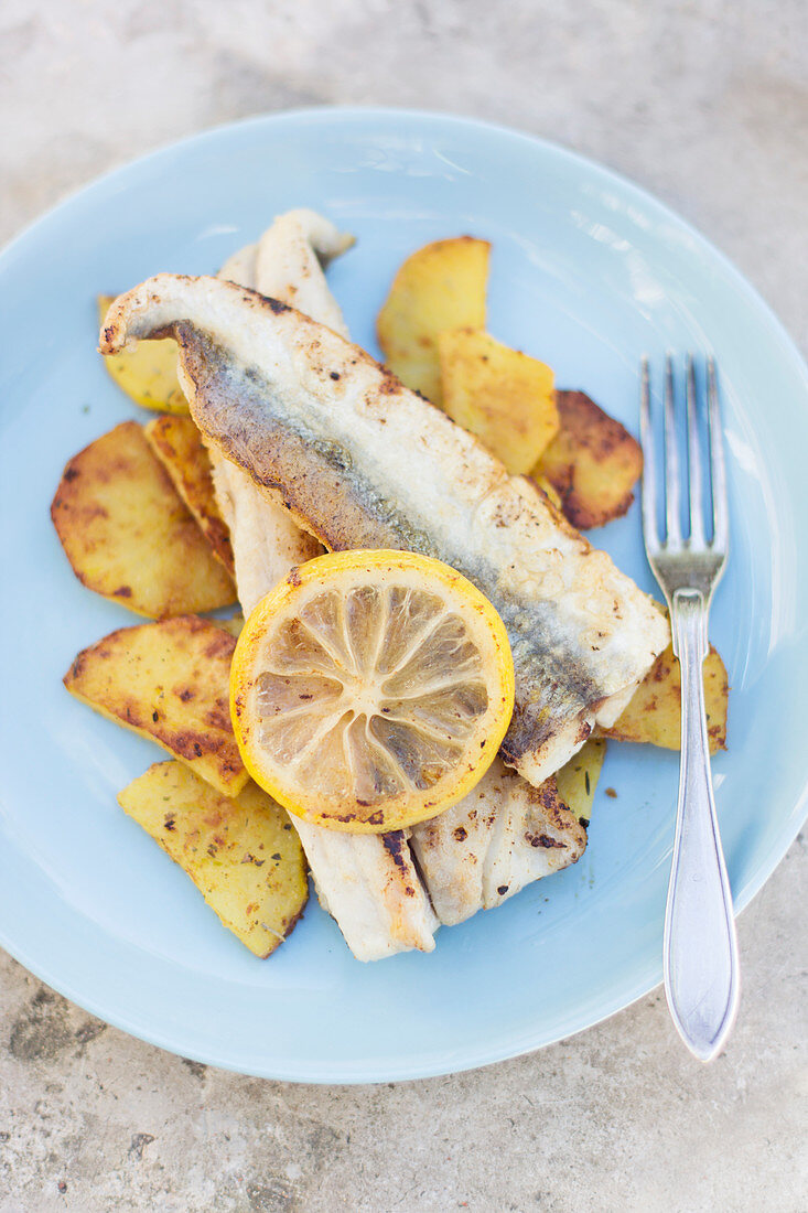 Pan seared garfish fillets with skin with crispy potato slices