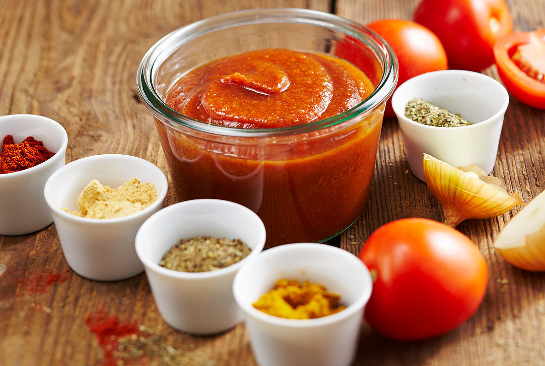 Homemade spicy tomato ketchup with ingredients