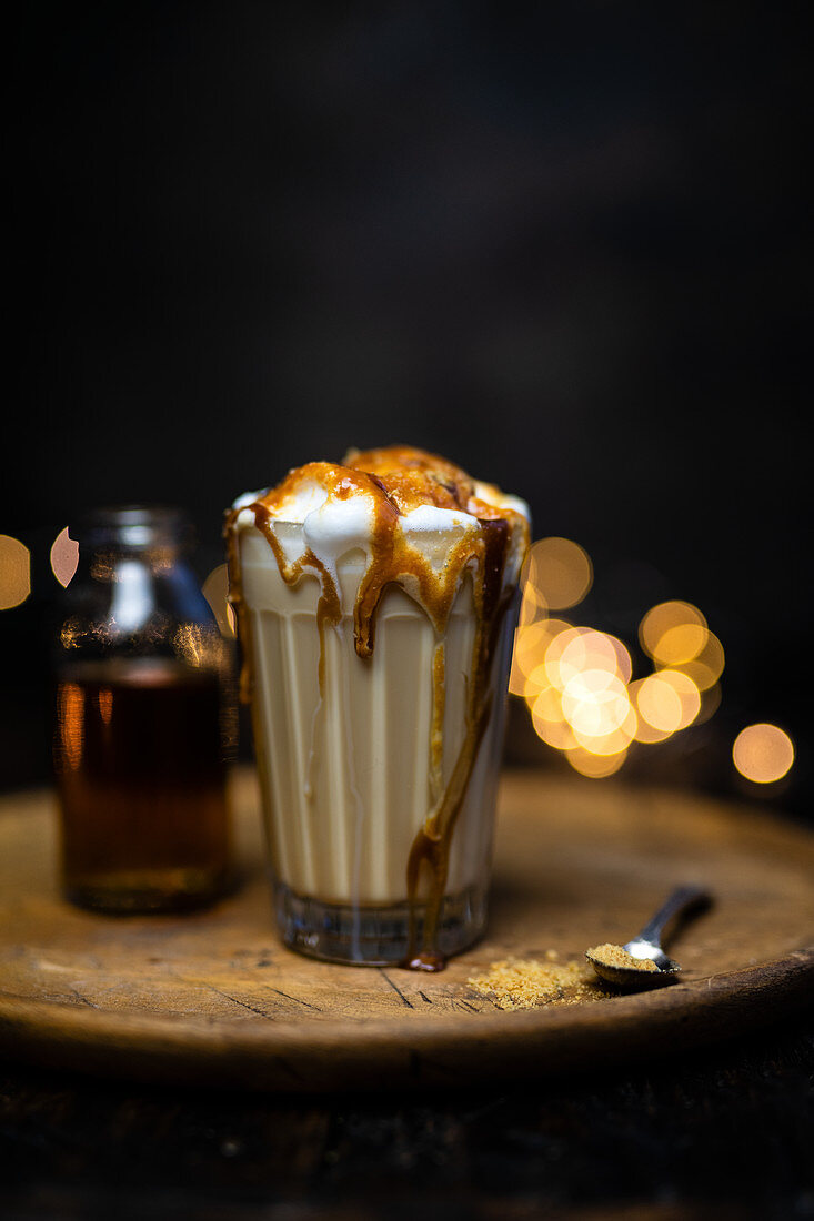 Latte macchiato with milk foam and caramel syrup