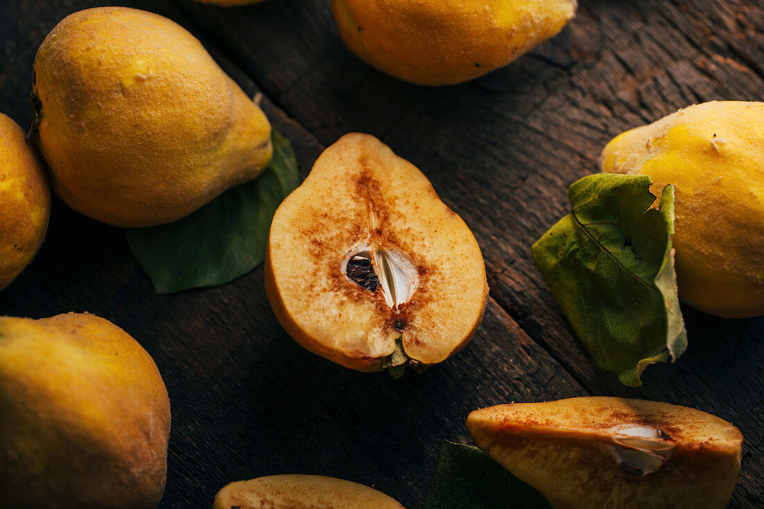 Quince fruits on dark wooden background