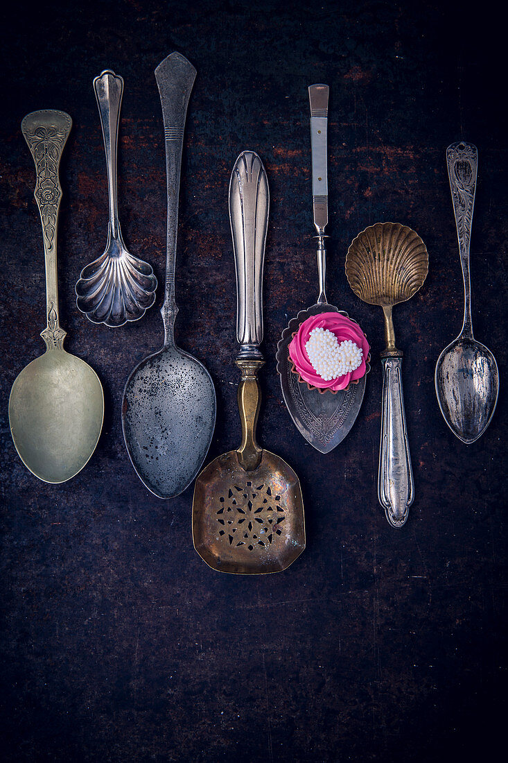 Vintage spoons and a chocolate praline
