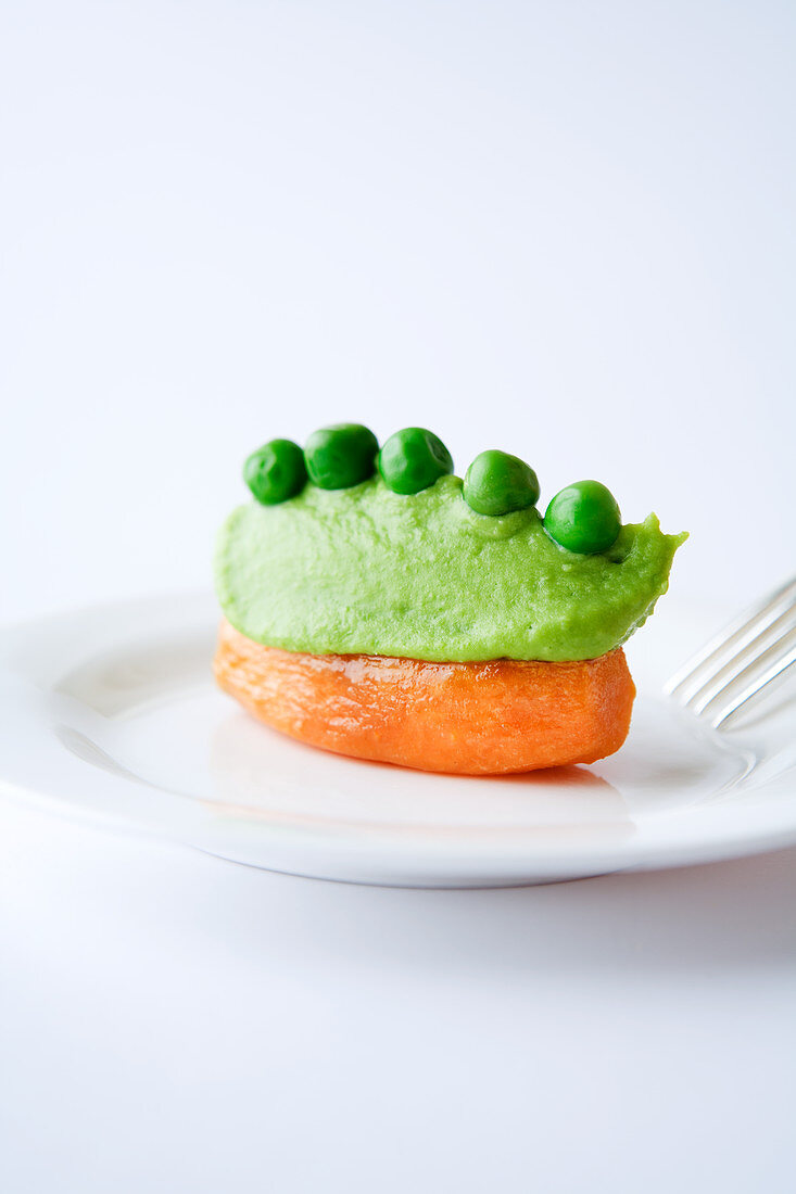 Stuffed carrot with pea puree