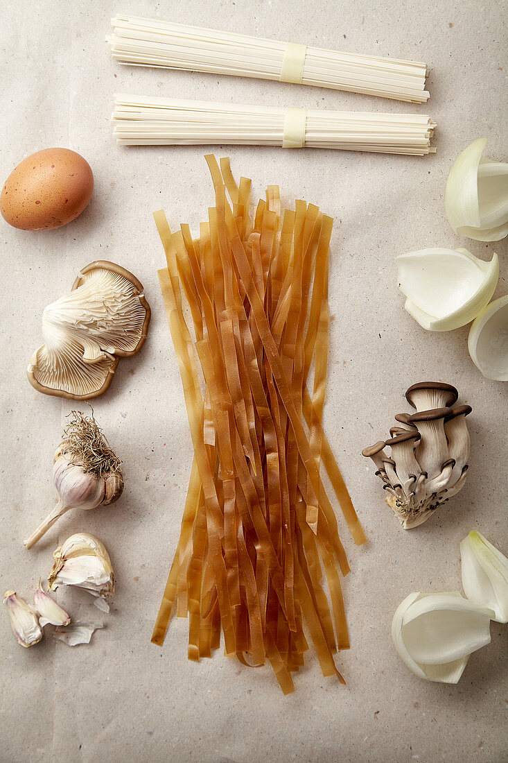 Red rice noodles, egg, udon noodles, onion, garlic and oyster mushrooms