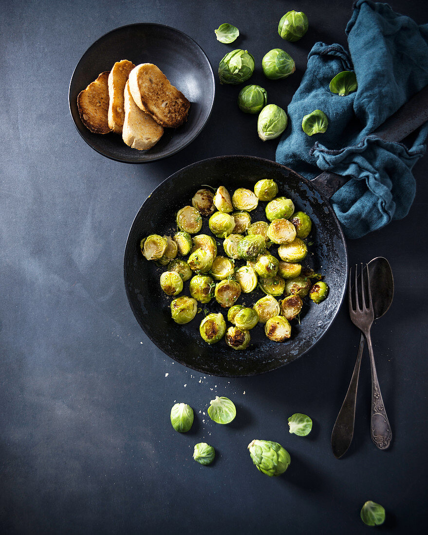Oven-baked brussels sprouts with salt flakes and cress, and baguette slices