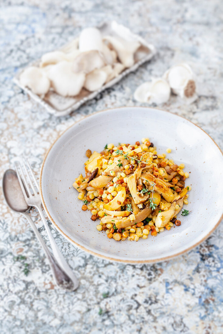 Risotto of mushrooms, sardines, Fregola noodles and thyme