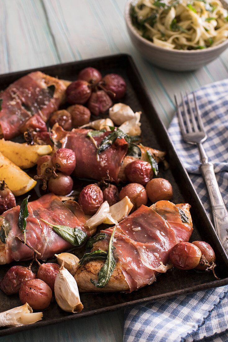 Chicken saltimbocca with roasted grapes and herbed linguine