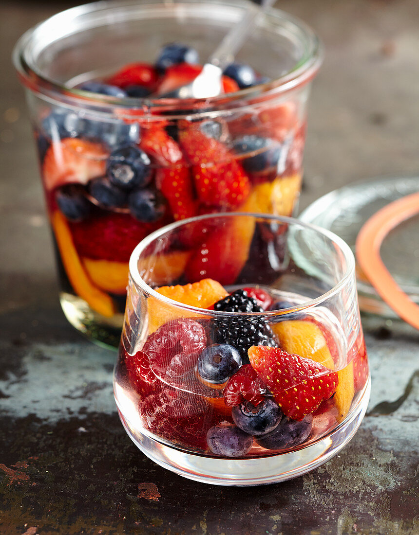 Homemade rum punch with berries and apricots