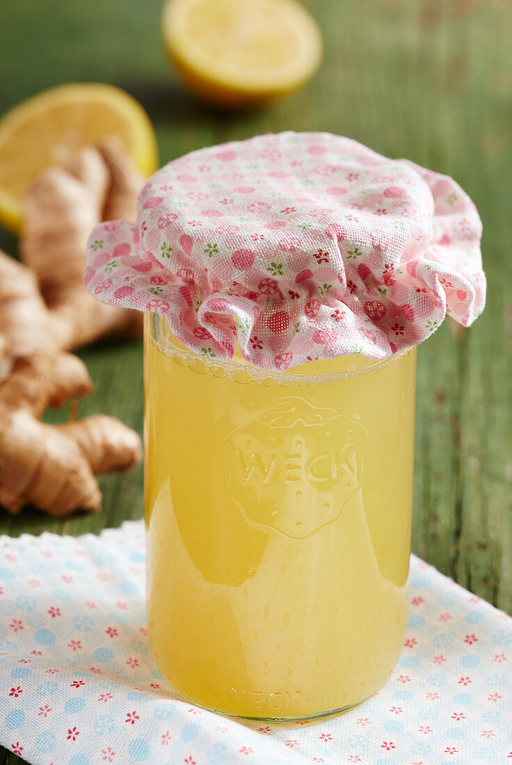 Homemade lemon and ginger syrup in a mason jar