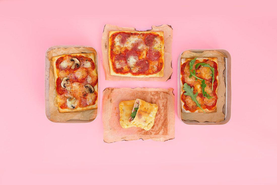 Four different types of take-away pizza