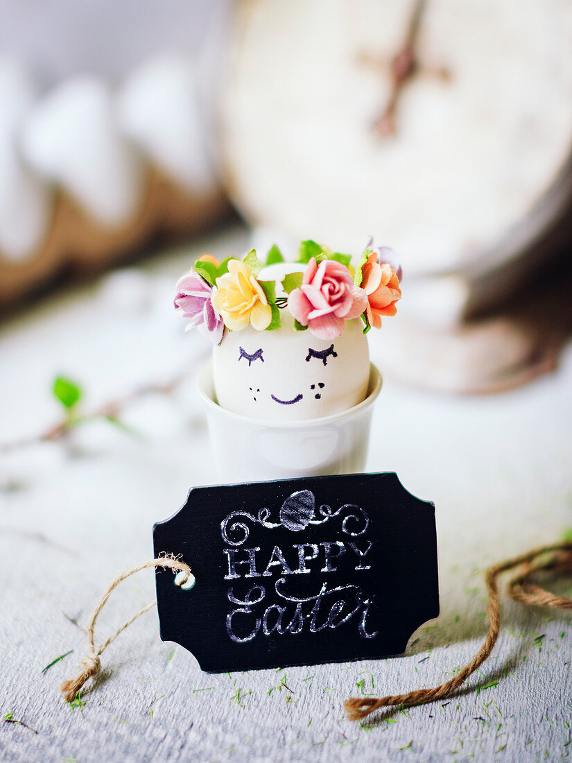 Flowers in Easter egg in egg cup