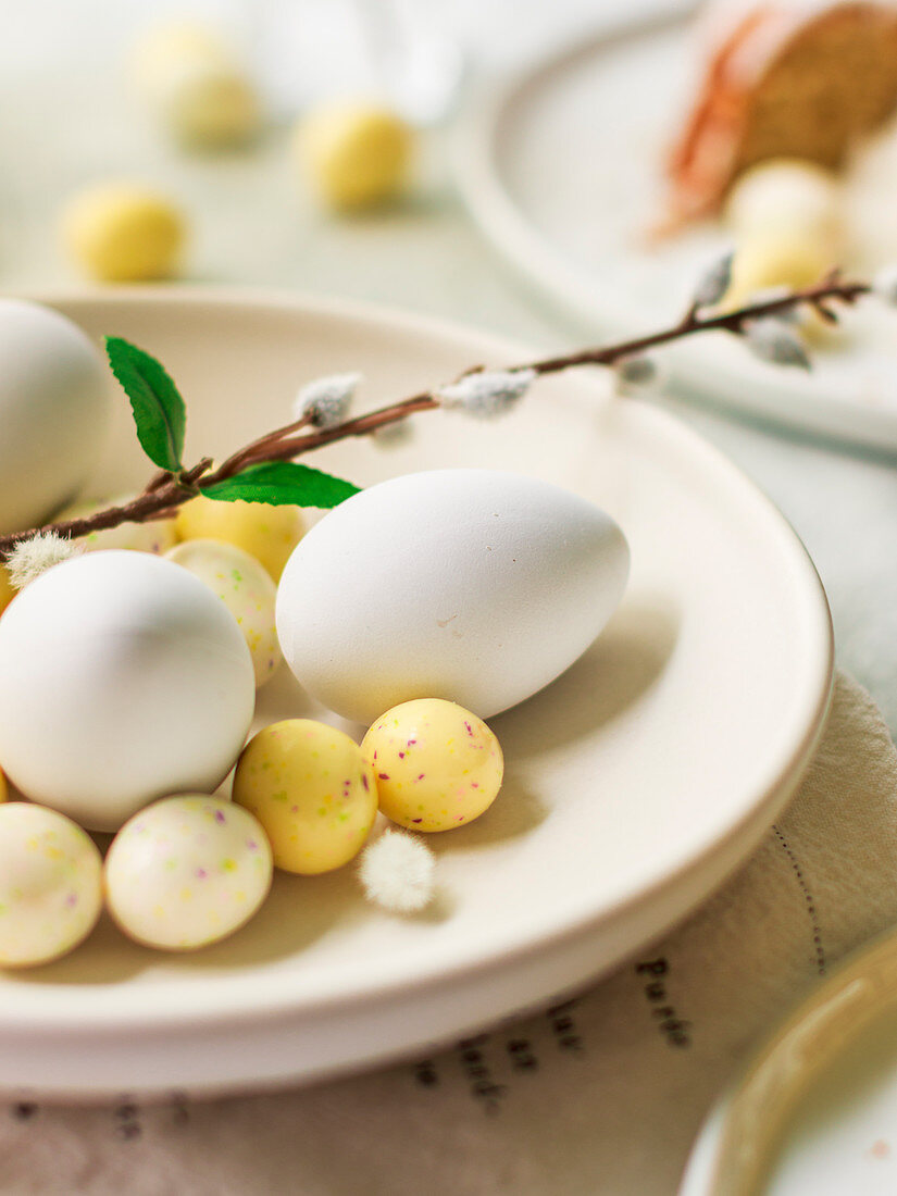 White eggs and chocolate Easter eggs