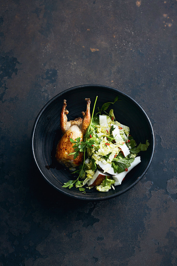 Oven-roasted quail with a Chinese cabbage and coconut salad