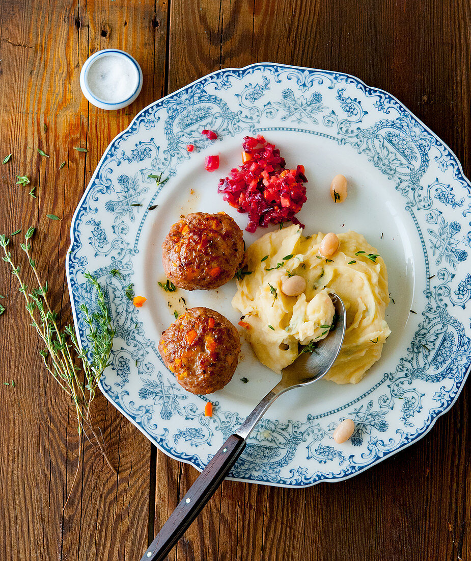 Meatballs with bean purée and beetroot salad