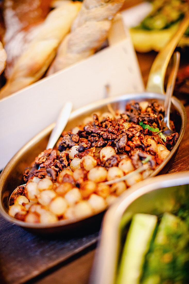Antipasti pearl onions with walnuts and cayenne pepper