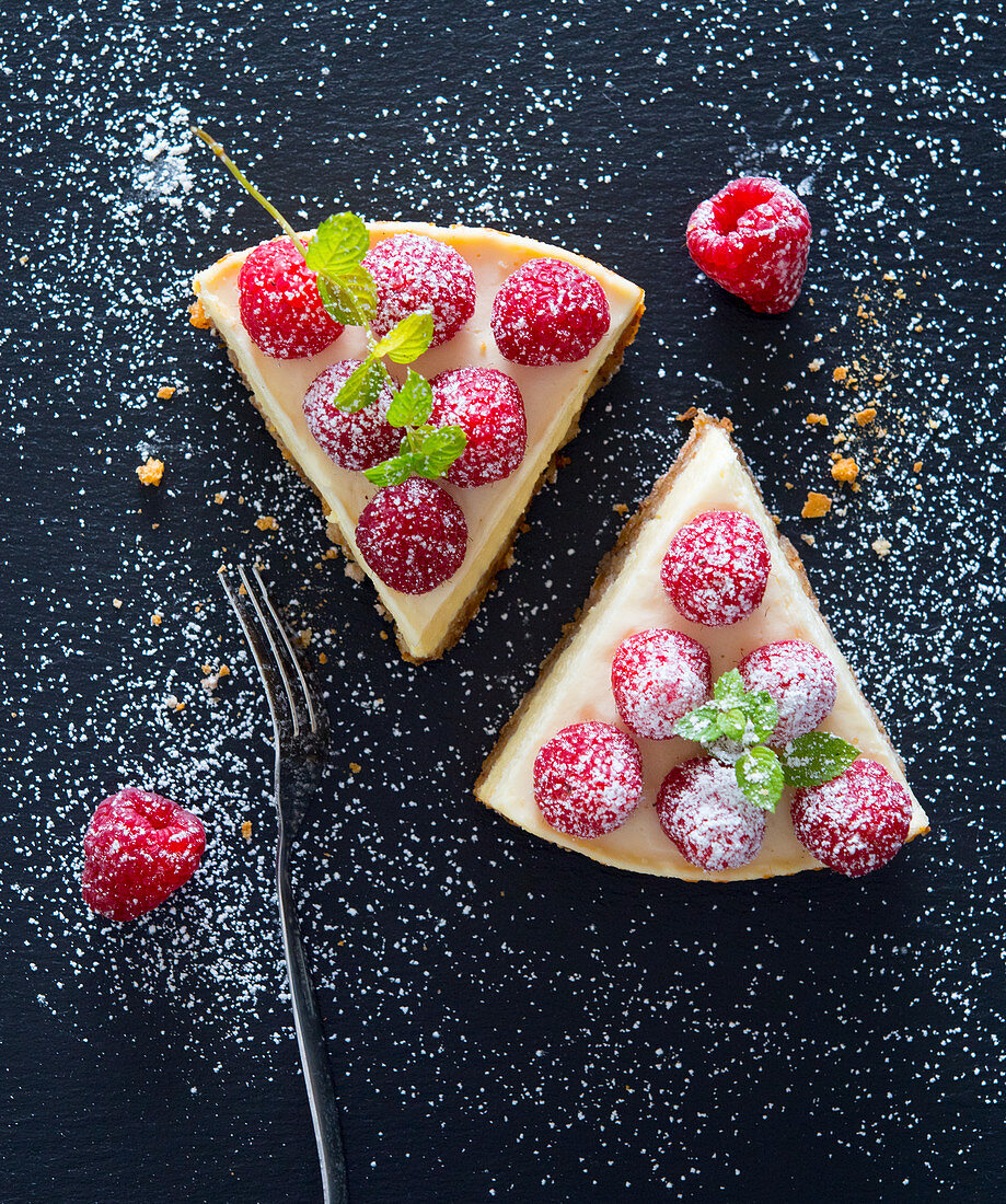 Two slices of raspberry cheesecake