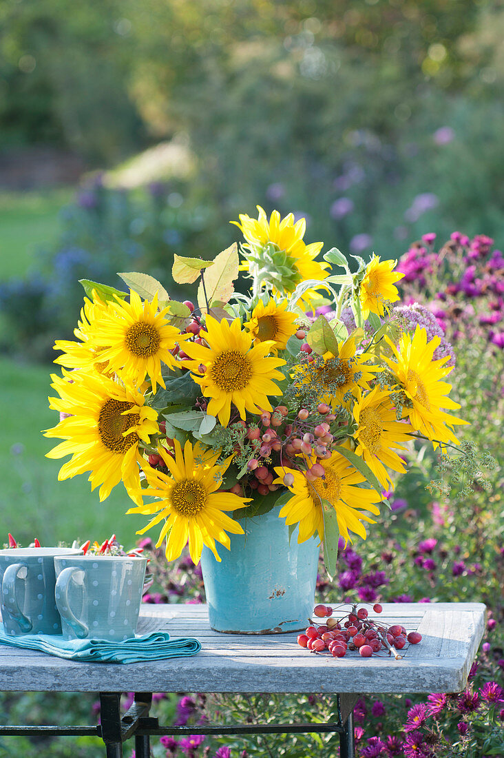 Late summer bouquet with sunflowers and crab apples