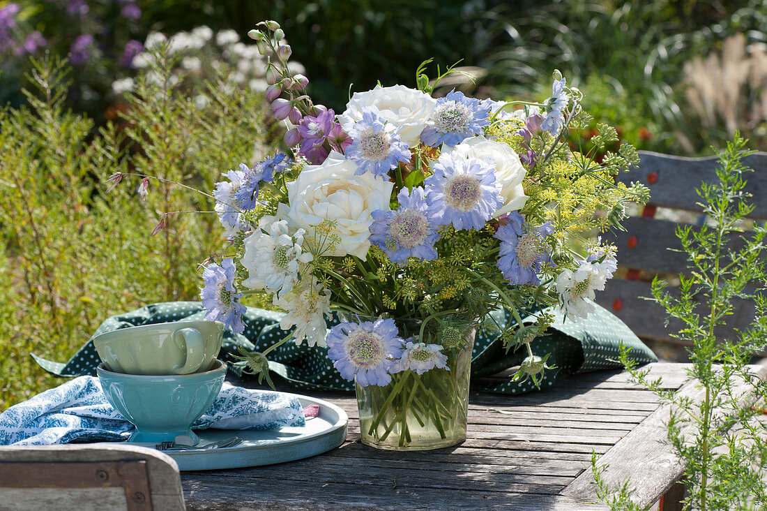 Summer bouquet of roses, scabiosa, fennel umbels and delphinium