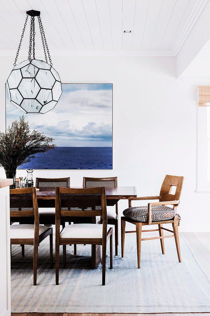 Dining room with hanging lamp and posters on the wall