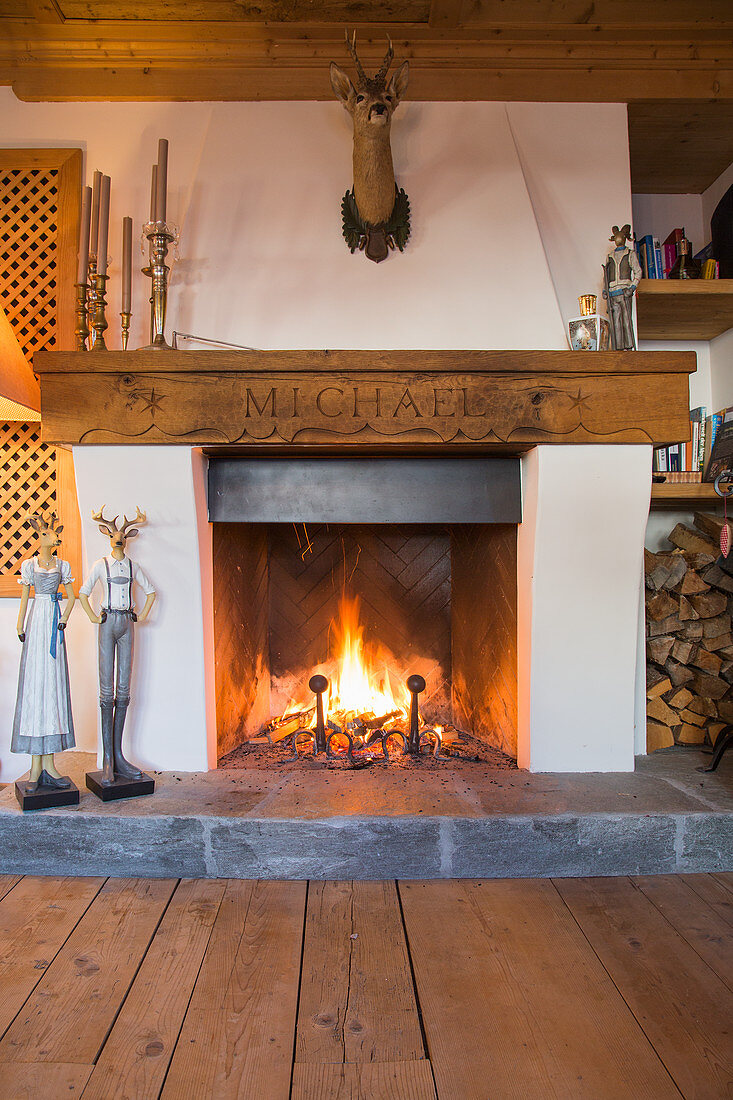 Lit open fire in traditional Swiss farmhouse