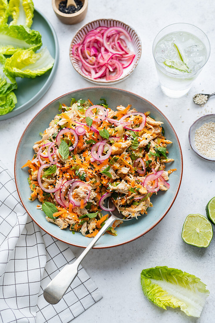 Healthy satay chicken salad with pickled onions