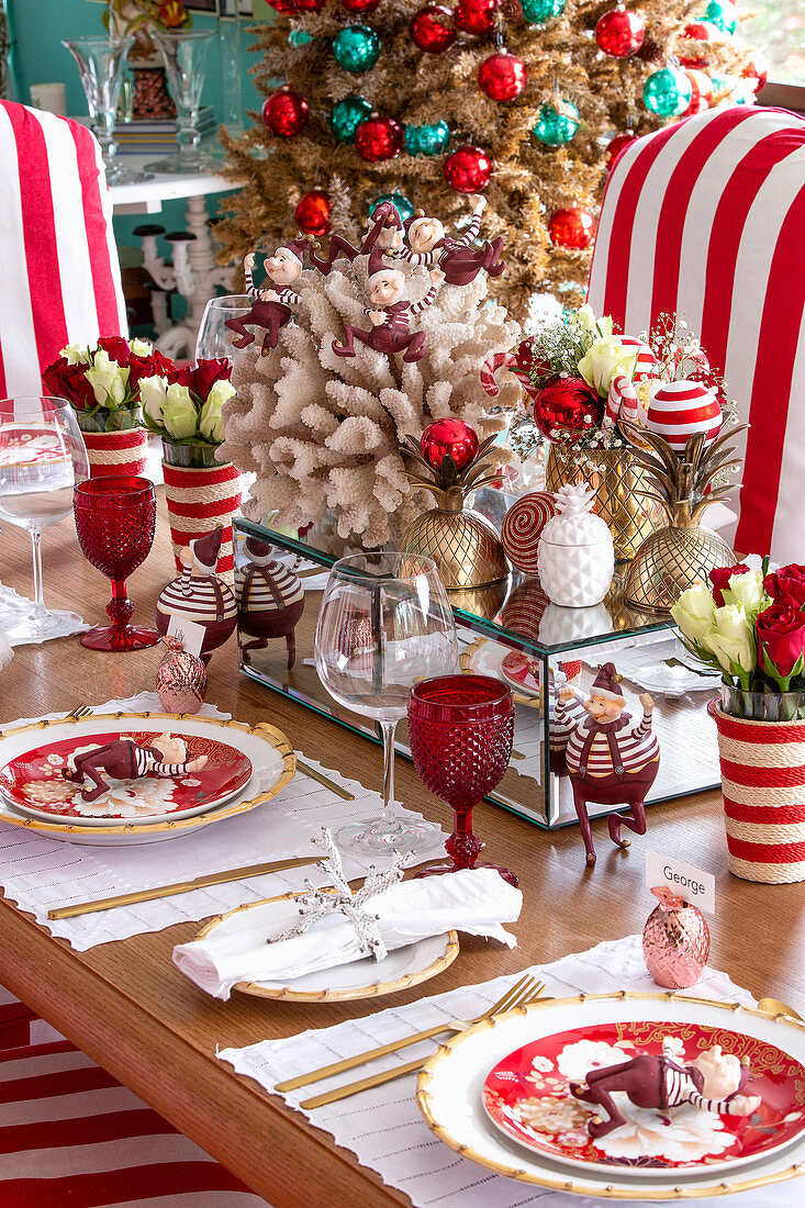 Festively set table decorated in red and white