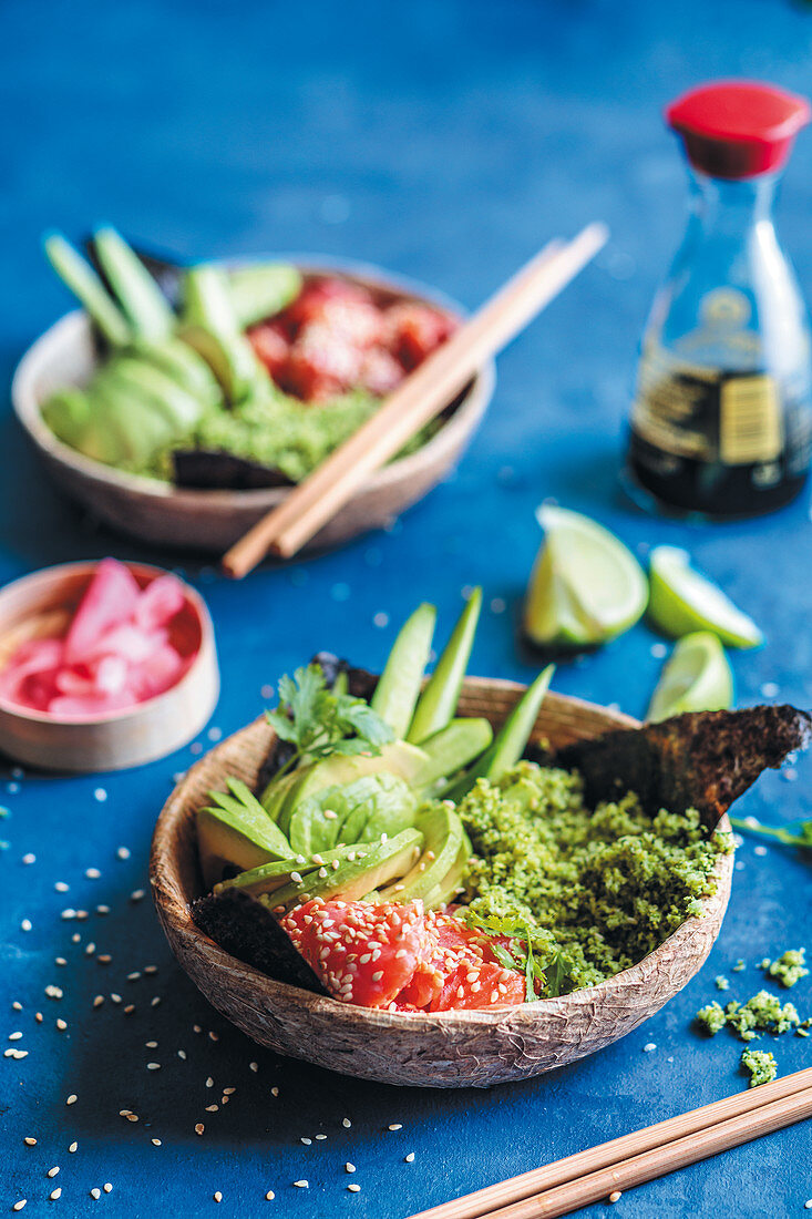 Sushi bowl with salmon, avocado, cucumber and broccoli rice
