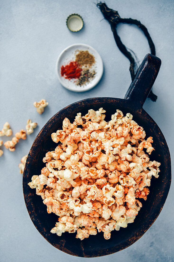 Spicy popcorn served in a large wooden bowl