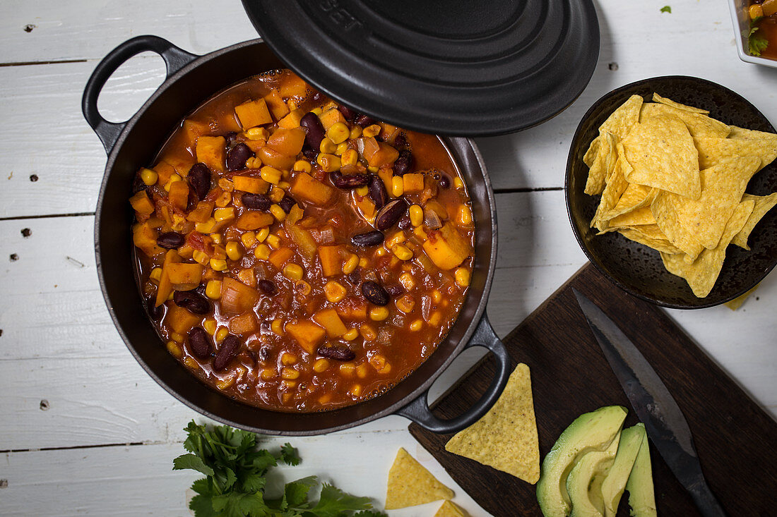 Sweet potato chili with avocado and nachos