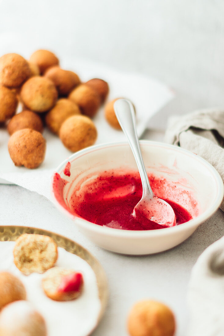 Farm cheese donut balls with strawberry sauce