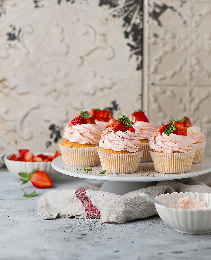 Strawberry cupcakes on a cake stand