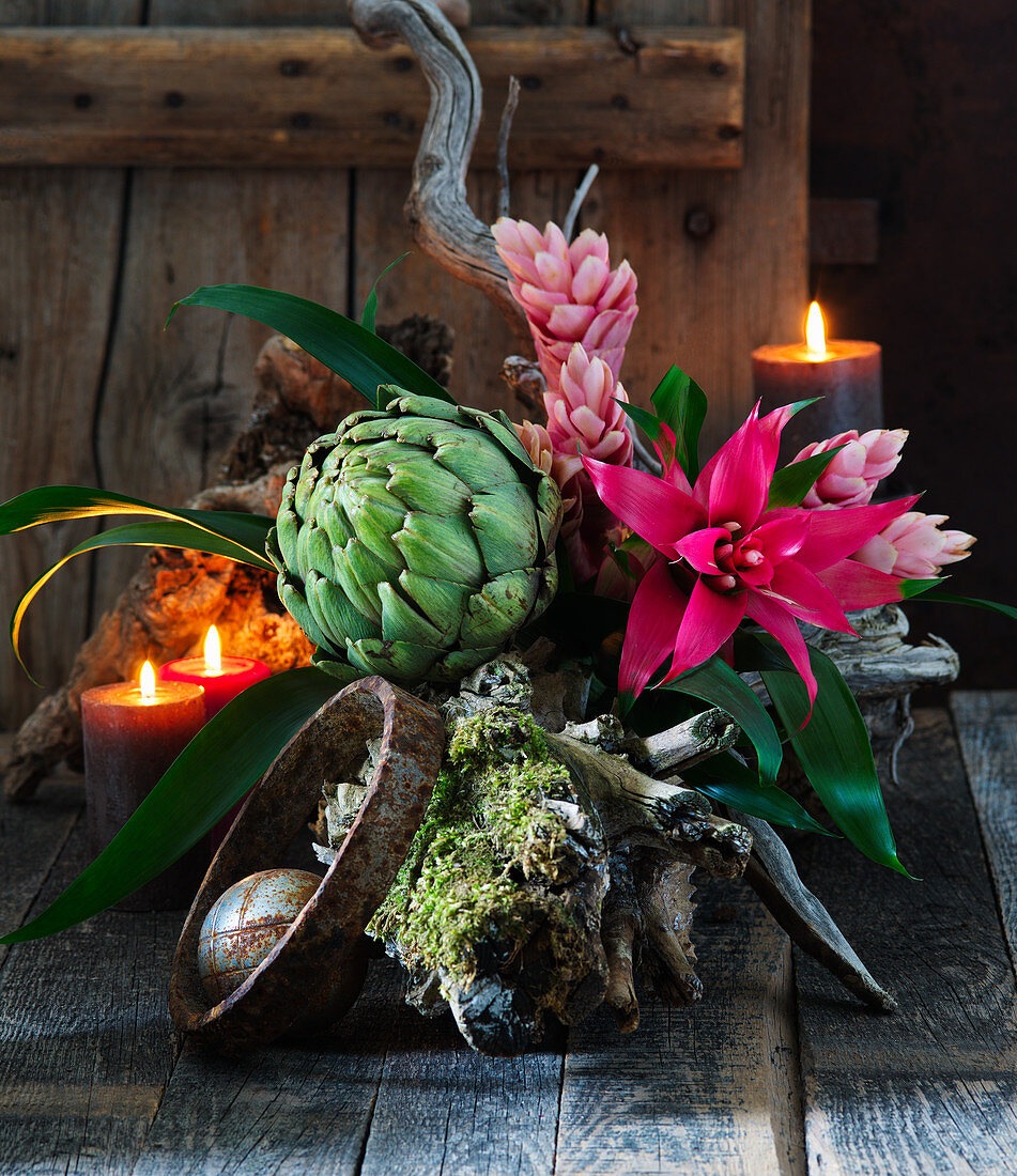 Arrangement of artichoke with Guzmania and Vriesea bromeliads