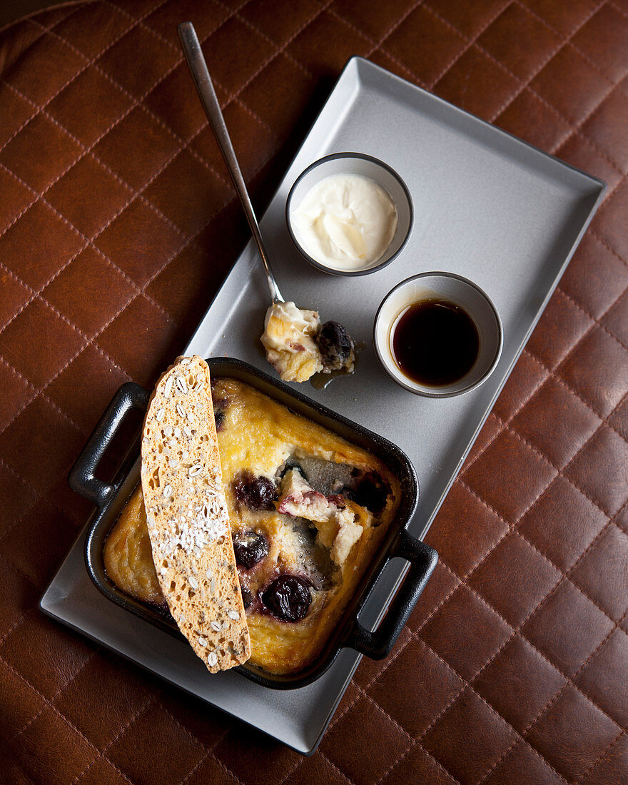 Small cherry clafoutis served with coffee