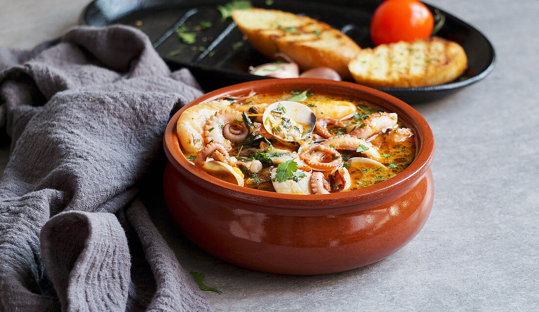 Octopus prawn soup with grilled bread