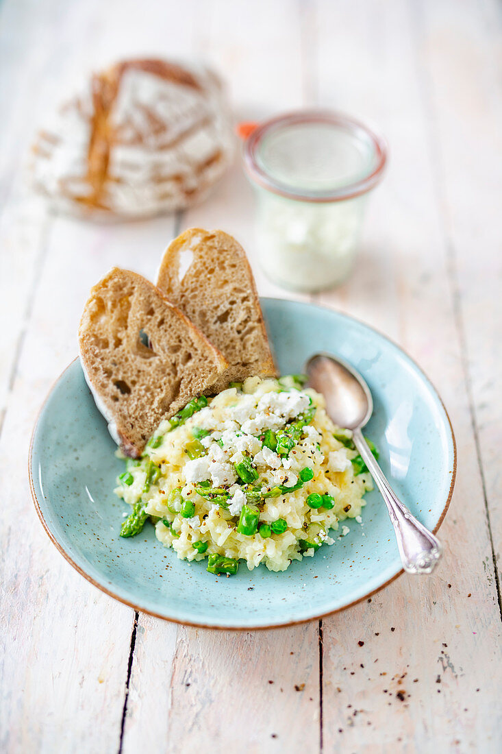 Risotto with homemade goat's cream cheese and sliced bread