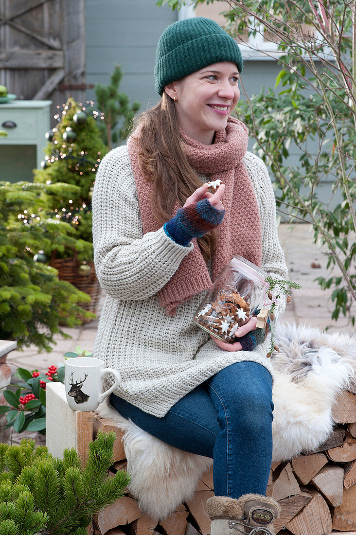 Woman snacking on cinnamon stars